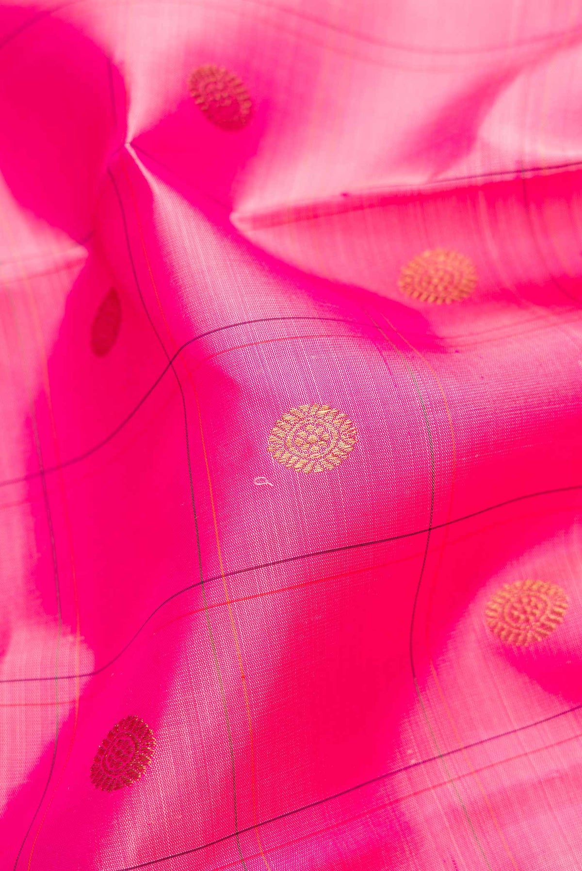 Close up of Pure Silk Pure Zari Pink Dual Tone Kanchipuram Saree with Checked design on the body and Zari Border.  displaying folds