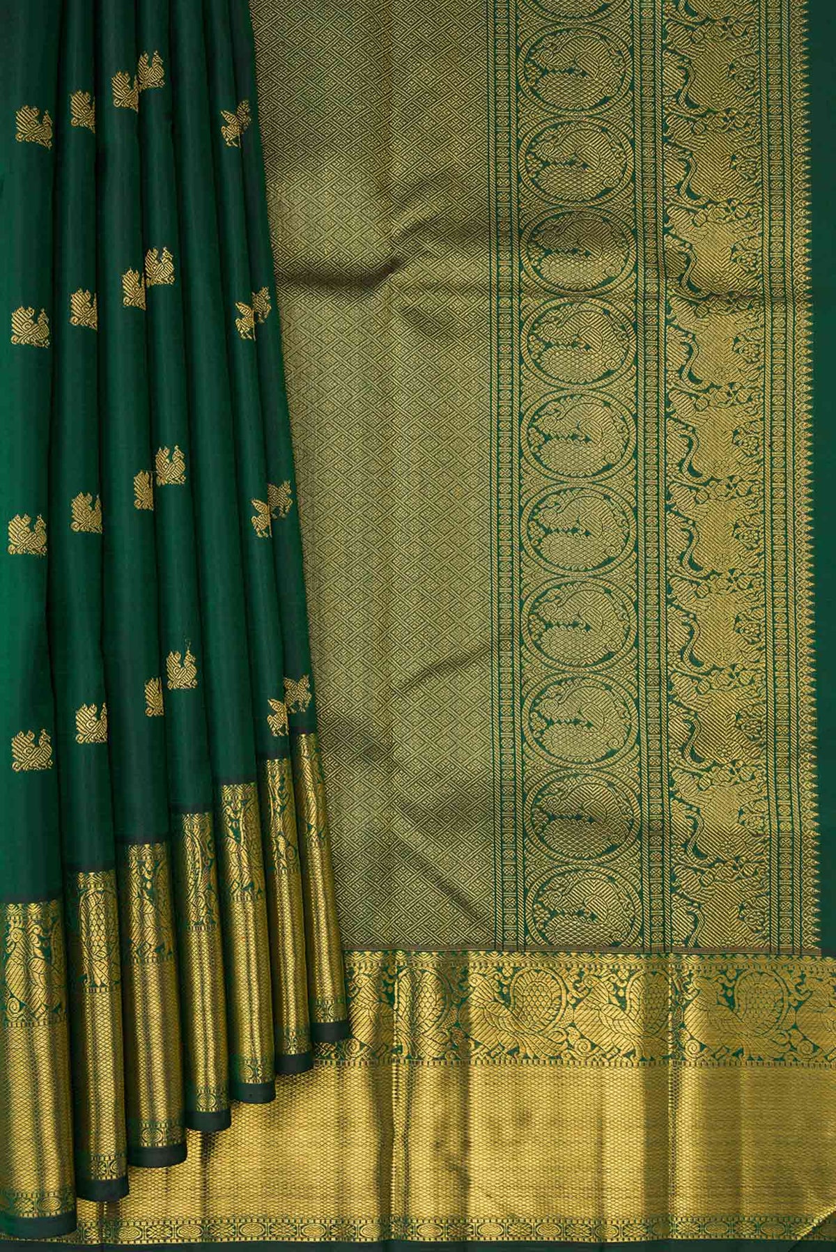 Pleats and pallu of Pure Silk Pure Zari Bottle Green Dual Tone Kanjivaram Saree with Zari Butta on the body and Zari Border. 