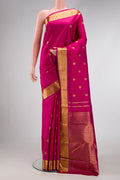 Pure Silk Pure Zari Magenta Dual Tone Kanchipuram Saree with Zari Butta on the body and Zari Border.  displayed on a mannequin