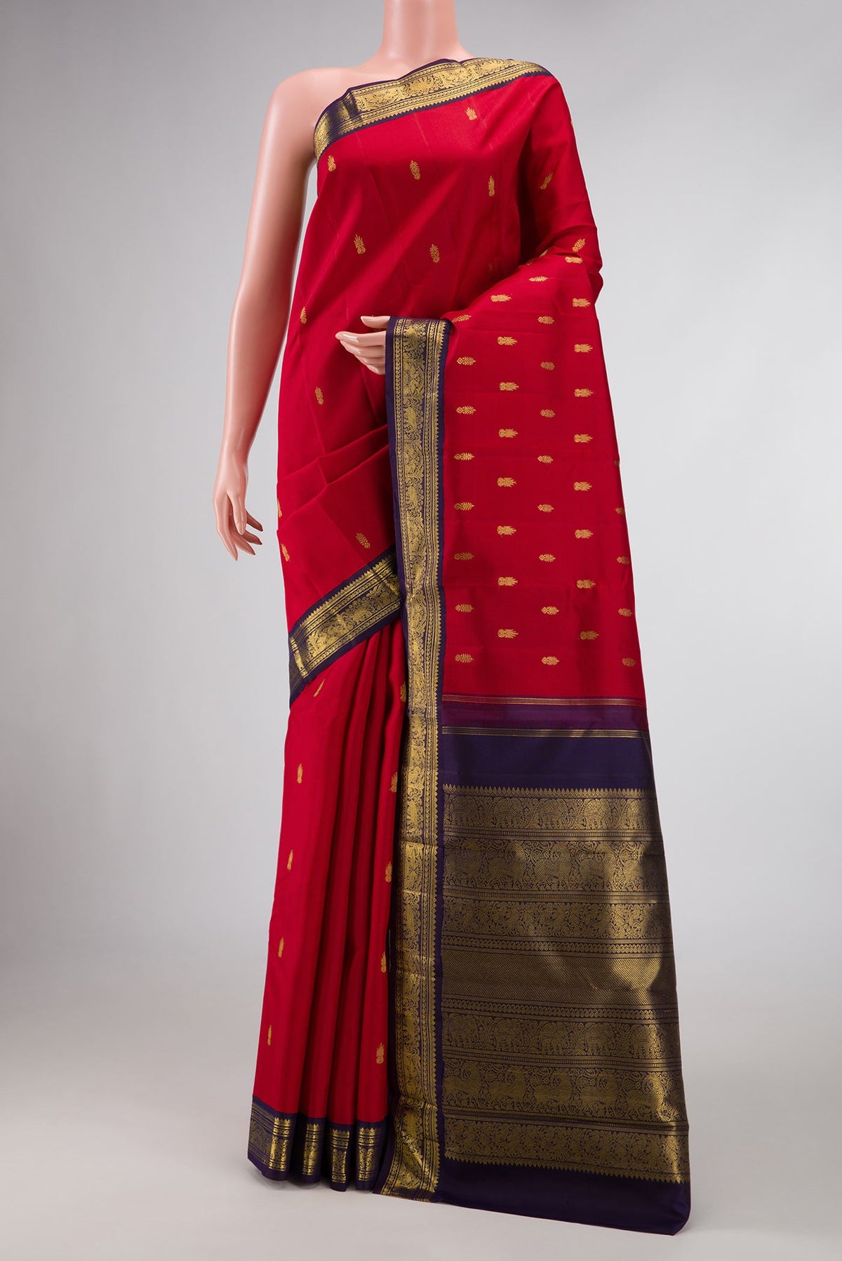 Pure Silk Pure Zari Red Dual Tone Kanchipuram Saree with Zari Butta on the body and Zari Border displayed on a mannequin
