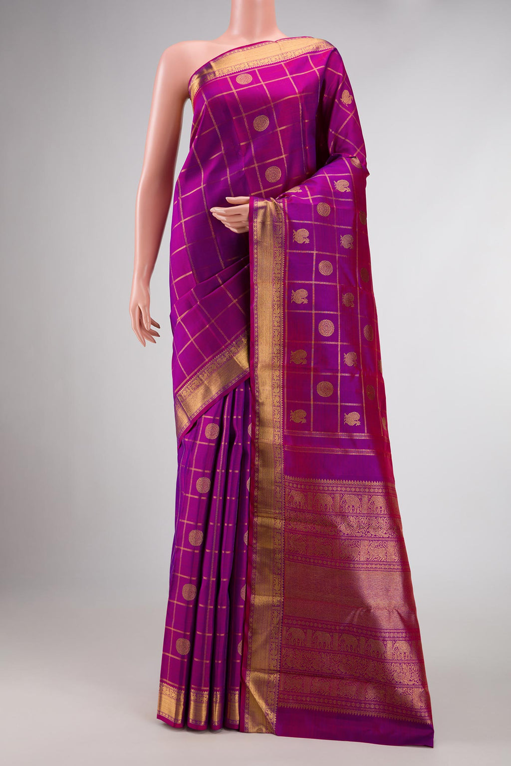 Pure Silk Pure Zari Purple Dual Tone Kanchipuram Saree with Checked design on the body and Zari Border displayed on a mannequin