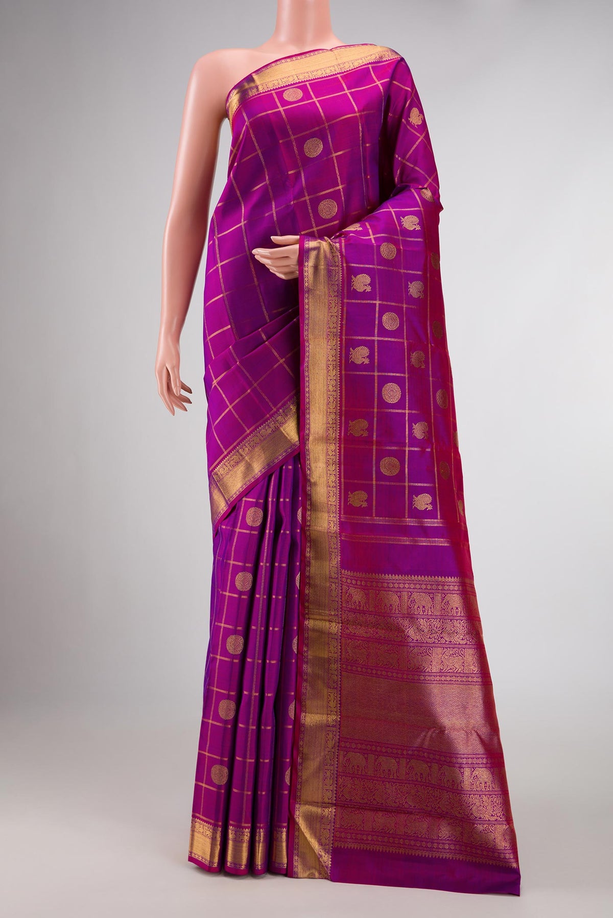 Pure Silk Pure Zari Purple Dual Tone Kanchipuram Saree with Checked design on the body and Zari Border displayed on a mannequin