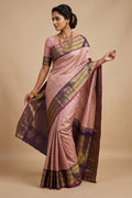 Model wearing a Pure Silk Pure Zari Rose Gold Dual Tone Kanchipuram Saree with Checked design on the body and Zari Border.