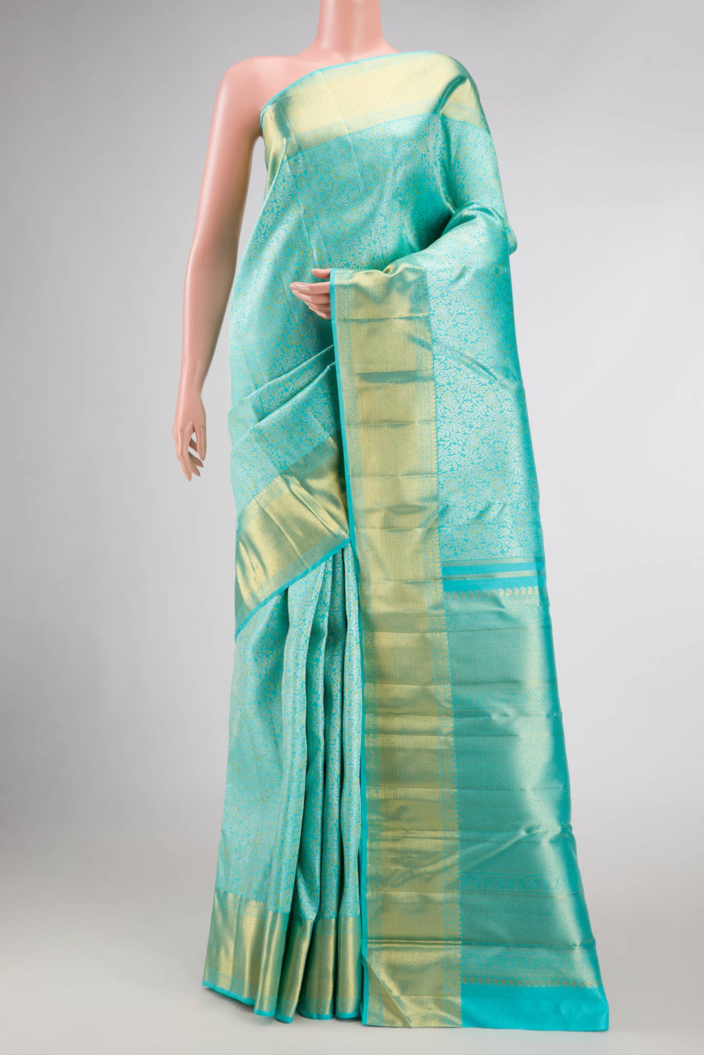Pure Silk Pure Zari Sky Blue Dual Tone Kanchipuram Saree with Zari Brocade on the body and Zari Border displayed on a mannequin