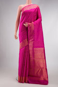 Pure Silk Pure Zari Pink Dual Tone Kanjivaram Saree with Zari Butta on the body and Zari Border.  displayed on a mannequin