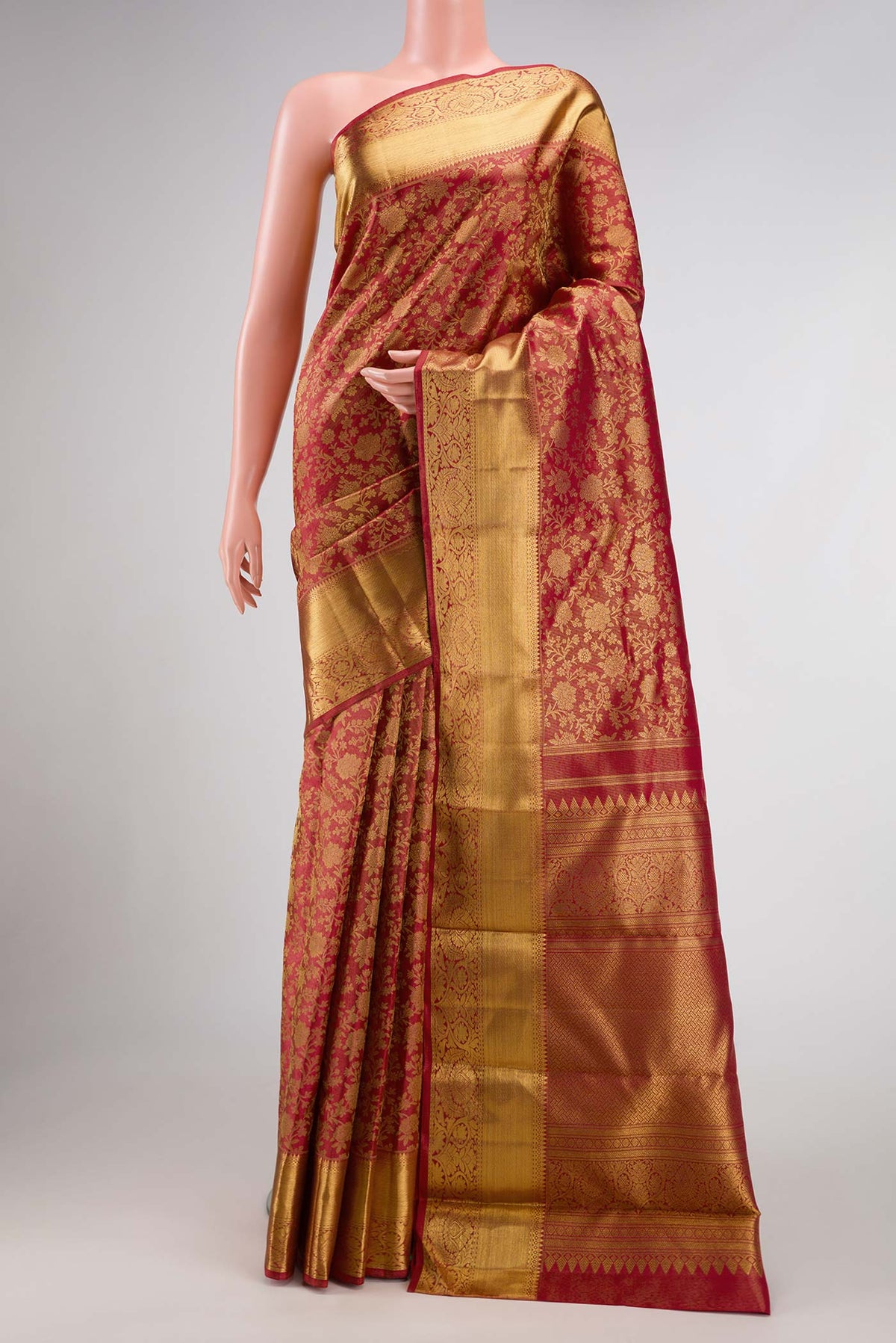 Pure Silk Pure Zari Red Dual Tone Kanjivaram Tissue Saree with Zari Brocade on the body and Zari Border.  displayed on a mannequin