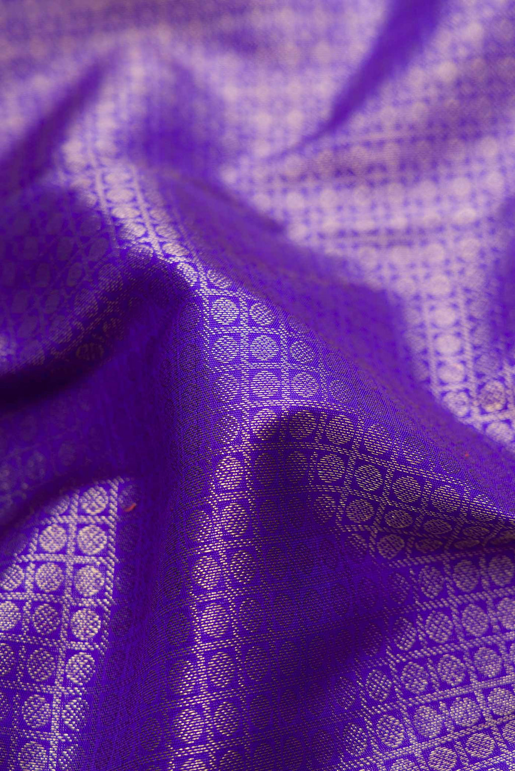 Close up of Pure Silk Pure Zari Royal Blue Dual Tone Kanchipuram Saree with Zari Brocade on the body and Zari Border displaying folds
