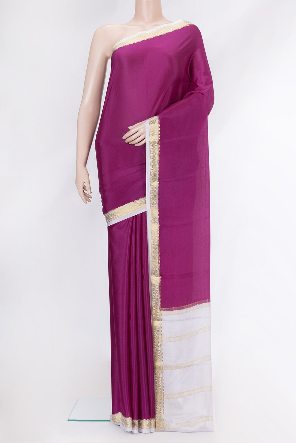Magenta Mysore Crepe Saree with Plain Body and Zari Border.  displayed on a mannequin