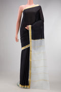 Black Mysore Crepe Saree with Plain Body and Zari Border.  displayed on a mannequin