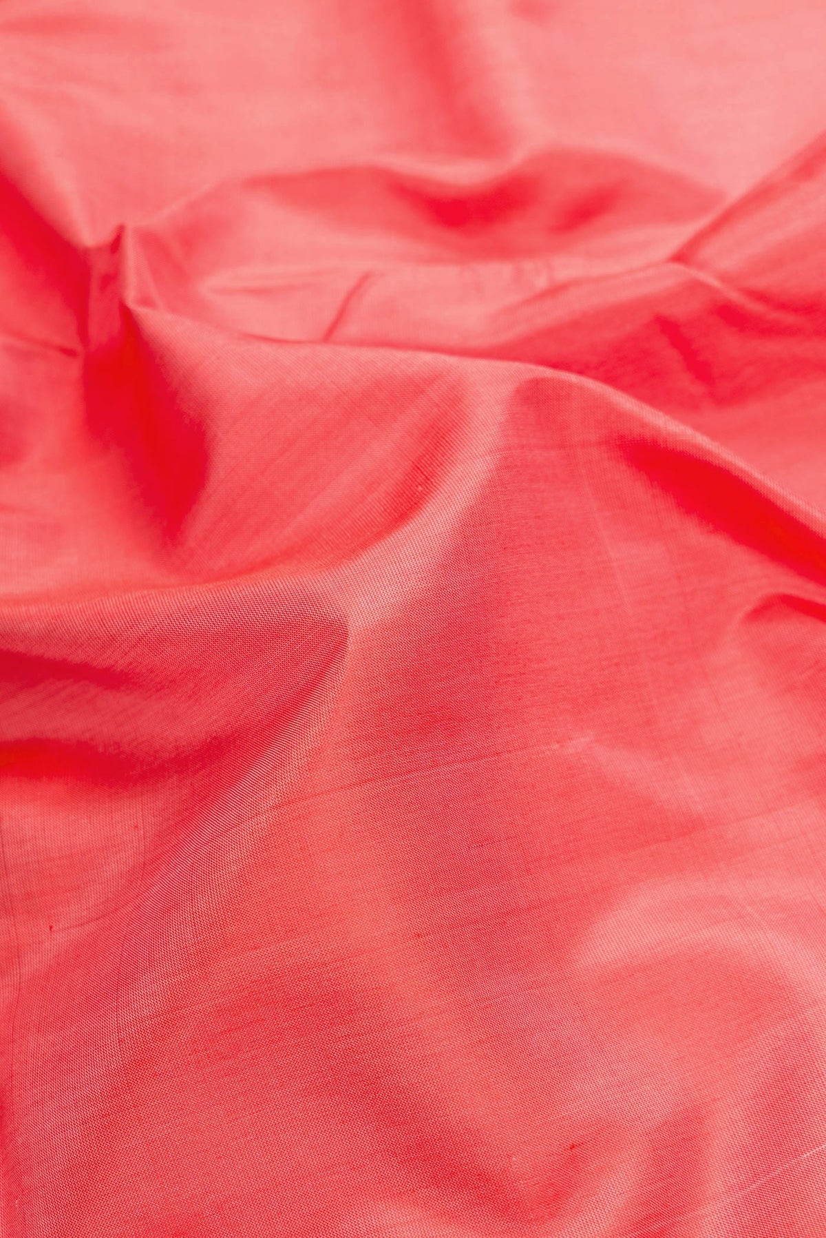Close up of Peach Dual Tone Uppada Silk Saree with Plain Body and Zari Border.  displaying folds