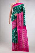 Green Pochampally Silk Saree with Pure Ikat on the body and Ikat Border displayed on a mannequin