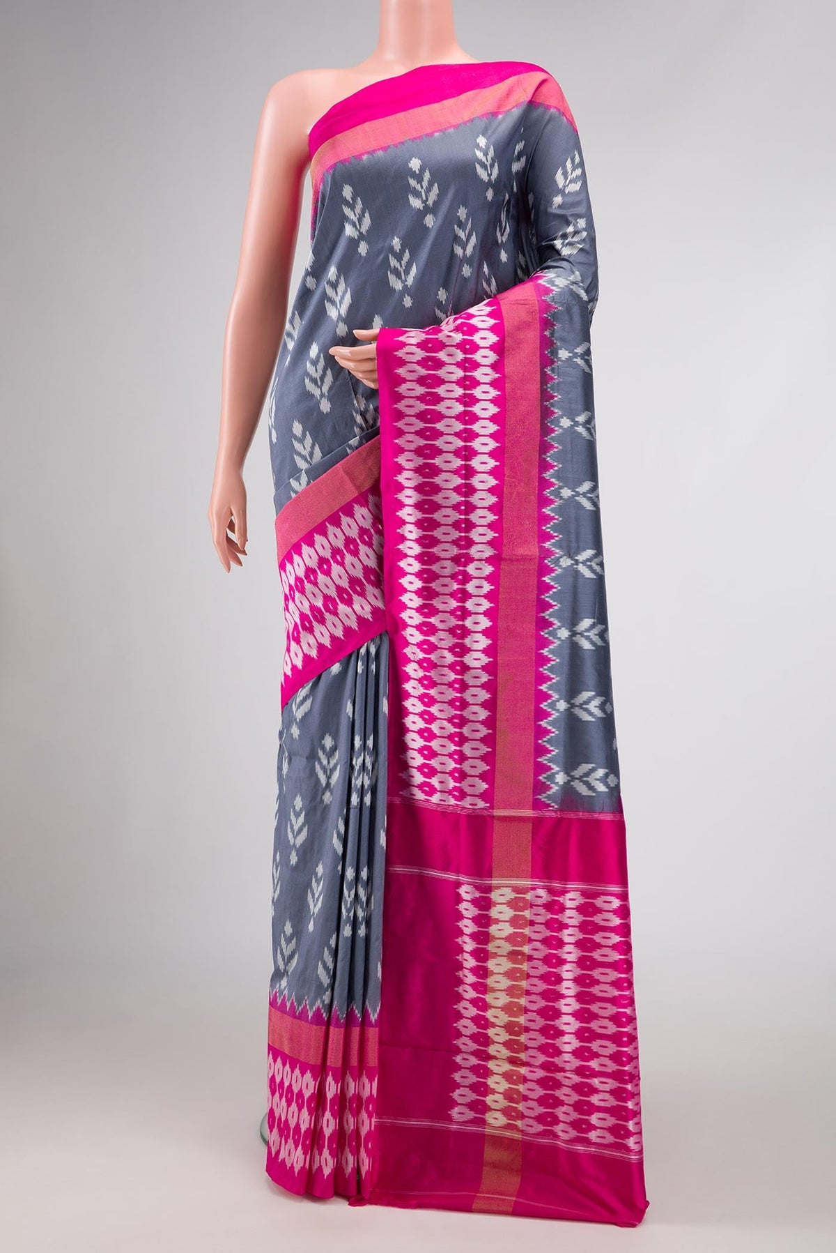 Grey Dual Tone Double Ikat Saree with Ikat Print on the body and Ikat Border.  displayed on a mannequin