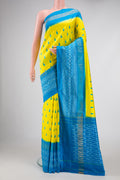 Lemon Yellow Pochampally Silk Saree with Pure Ikat on the body and Zari Border displayed on a mannequin