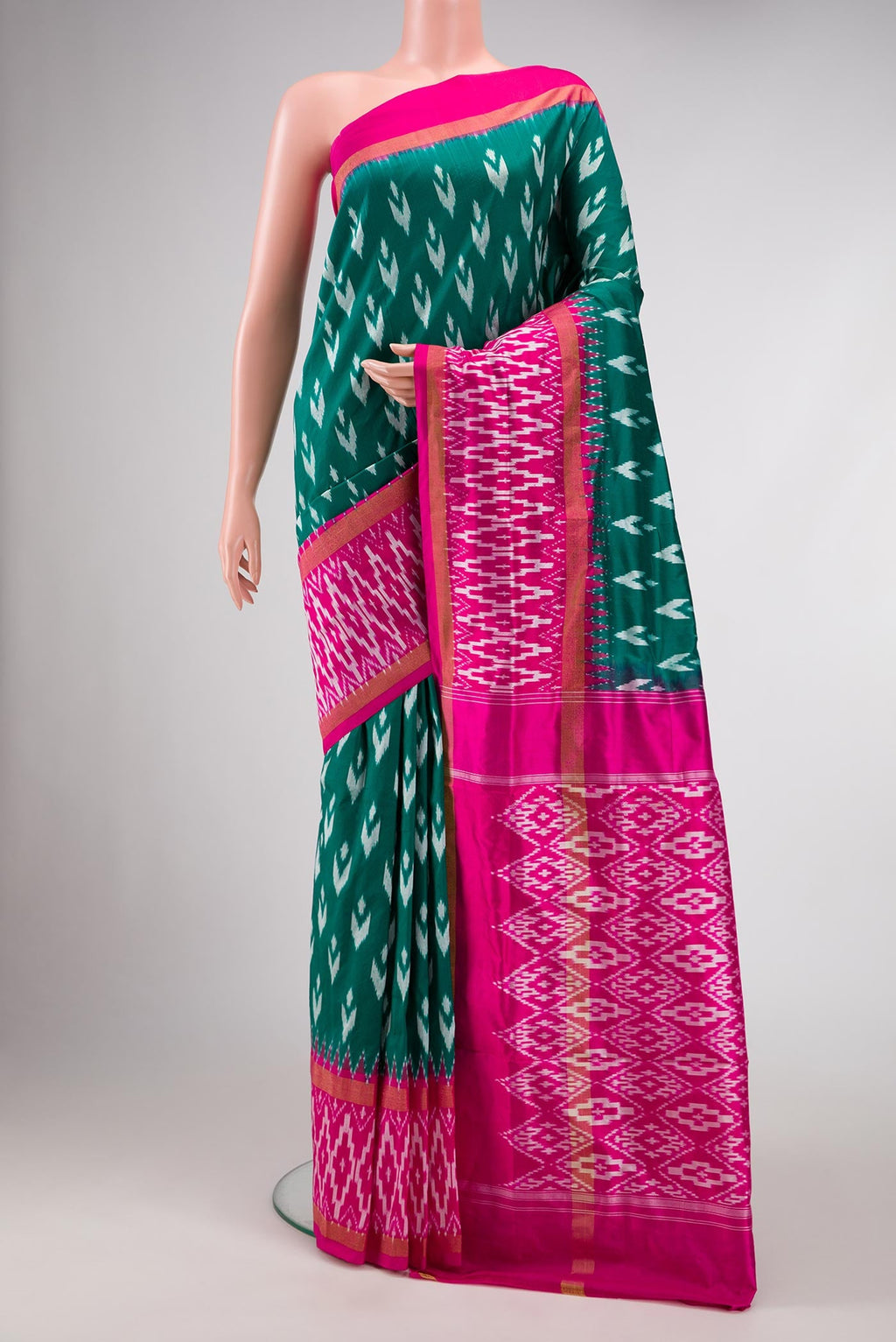 Green Dual Tone Double Ikat Saree with Ikat Print on the body and Ikat Border.  displayed on a mannequin