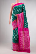 Green Dual Tone Double Ikat Saree with Ikat Print on the body and Ikat Border.  displayed on a mannequin
