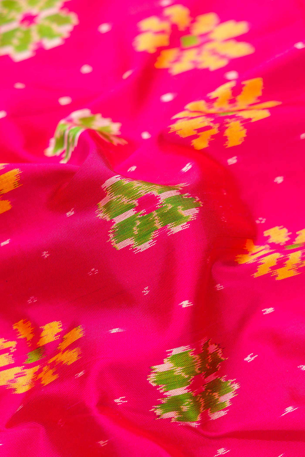 Close up of Pink Dual Tone Double Ikat Saree with Ikat Print on the body and Ikat Border.  displaying folds