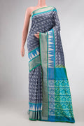 Grey Dual Tone Double Ikat Saree with Ikat Print on the body and Ikat Border displayed on a mannequin