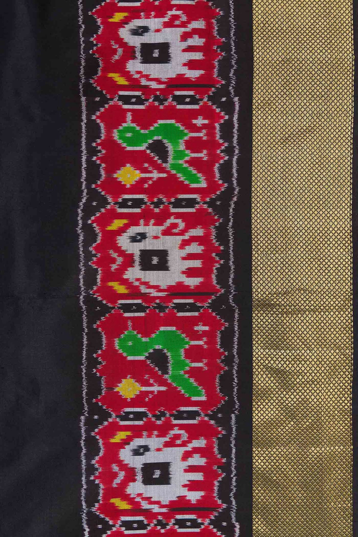 Border image of Black Dual Tone Double Ikat Saree with Plain Body and Ikat Border. 