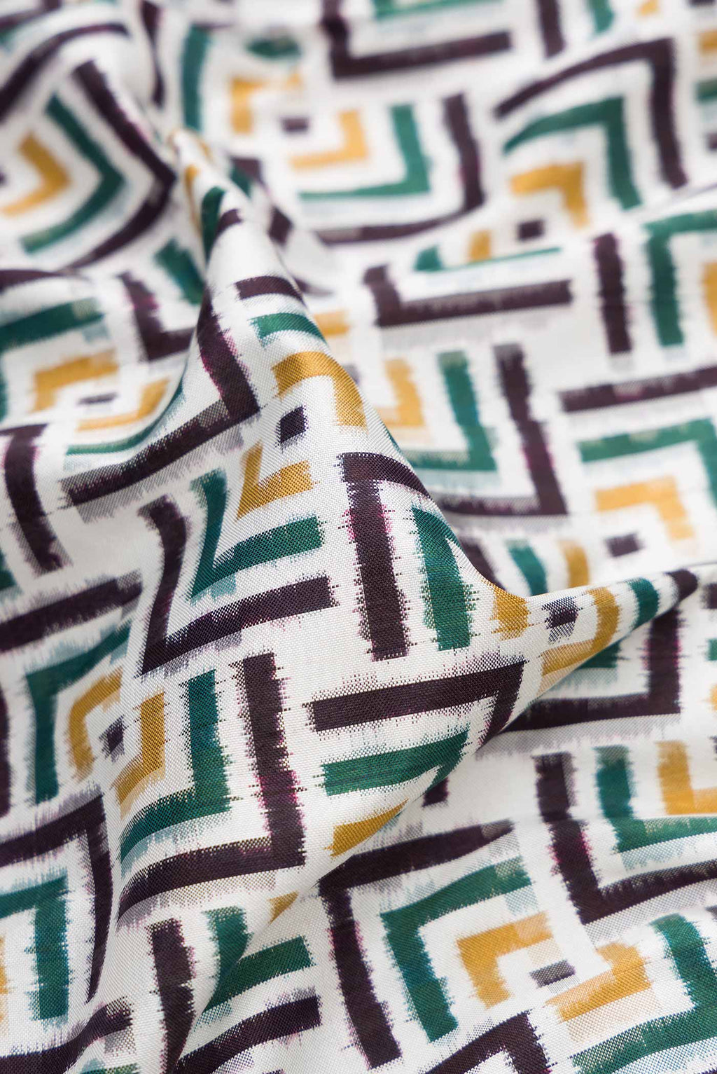 Close up of Off White Pochampally Silk Saree with Pure Ikat on the body and Plain Border displaying folds