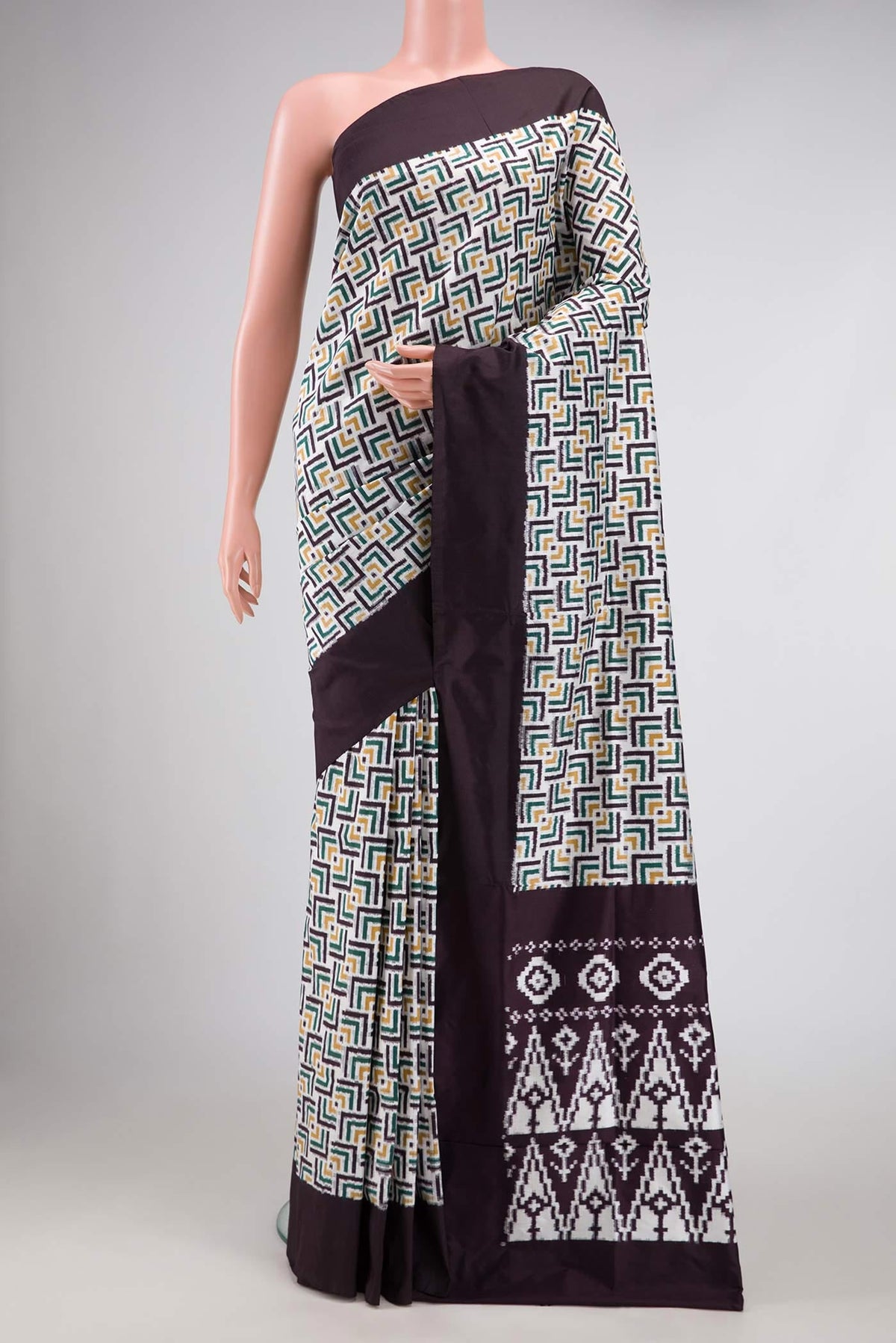 Off White Pochampally Silk Saree with Pure Ikat on the body and Plain Border displayed on a mannequin
