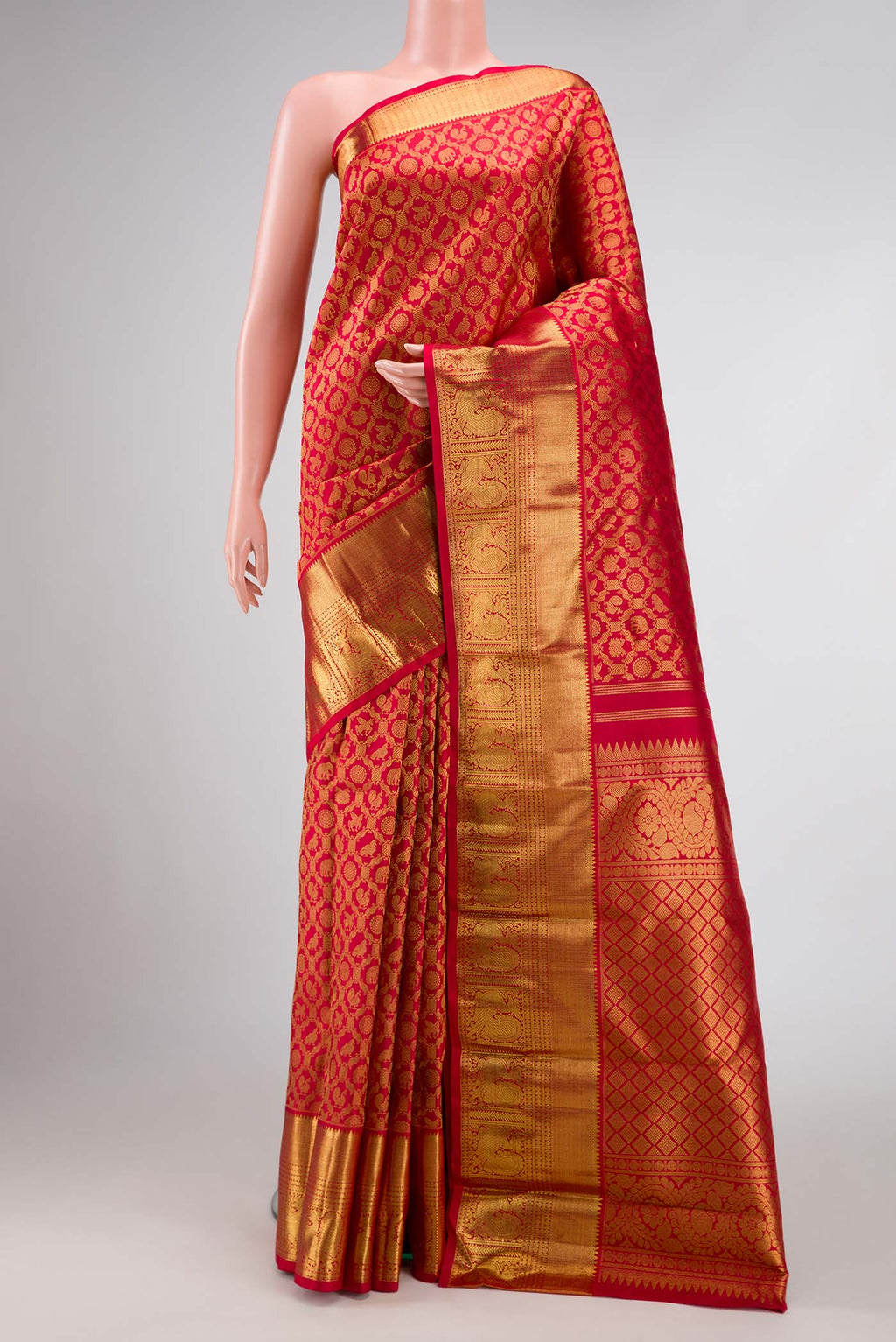 Pure Silk Pure Zari Red Dual Tone Kanchipuram Saree with Zari Brocade on the body and Zari Border displayed on a mannequin