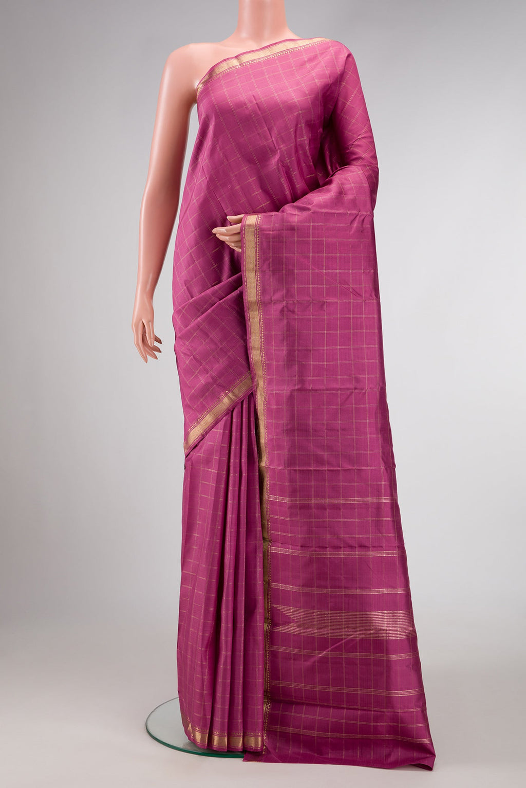 Pink Dual Tone Kanchipuram Silk Saree with Checked design on the body and Zari Border.  displayed on a mannequin
