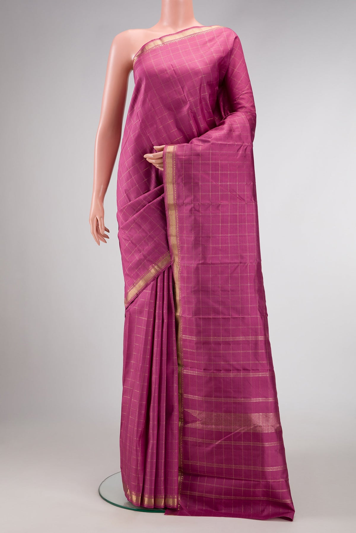 Pink Dual Tone Kanchipuram Silk Saree with Checked design on the body and Zari Border.  displayed on a mannequin