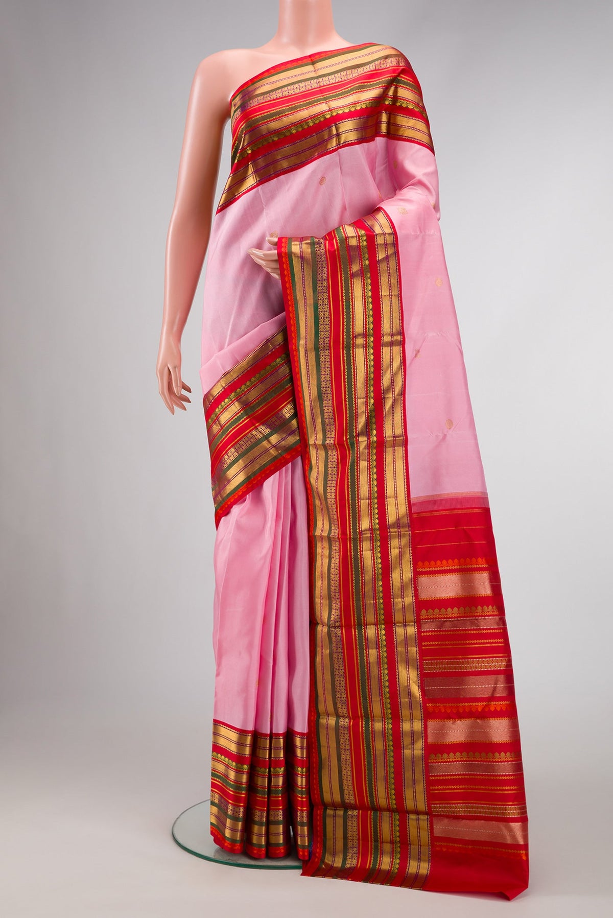 Pink Dual Tone Kanjivaram Silk Saree with Zari Butta on the body and Zari Border.  displayed on a mannequin
