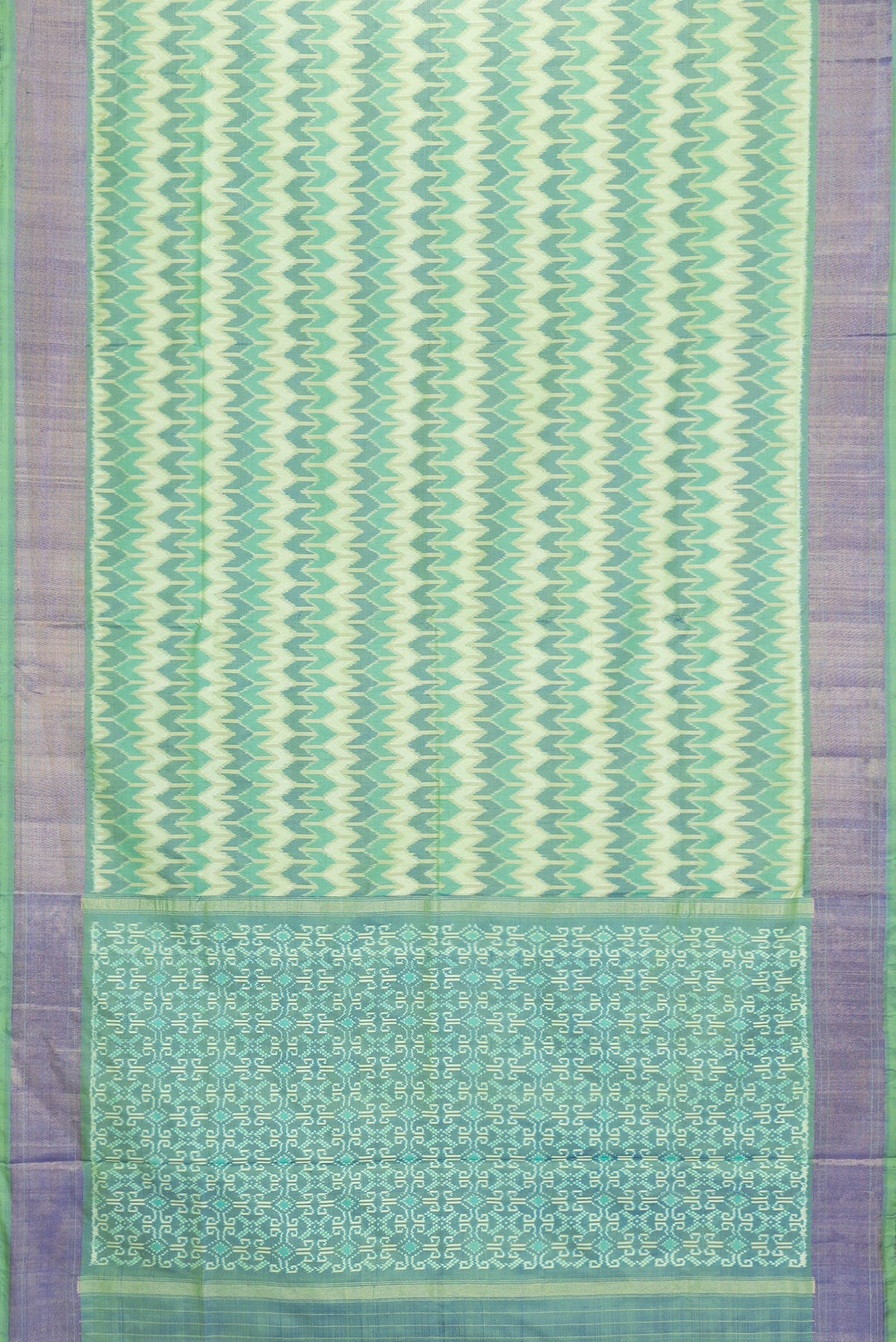 Flat view of Green Dual Tone Double Ikat Saree with Ikat Print on the body and Zari Border. 