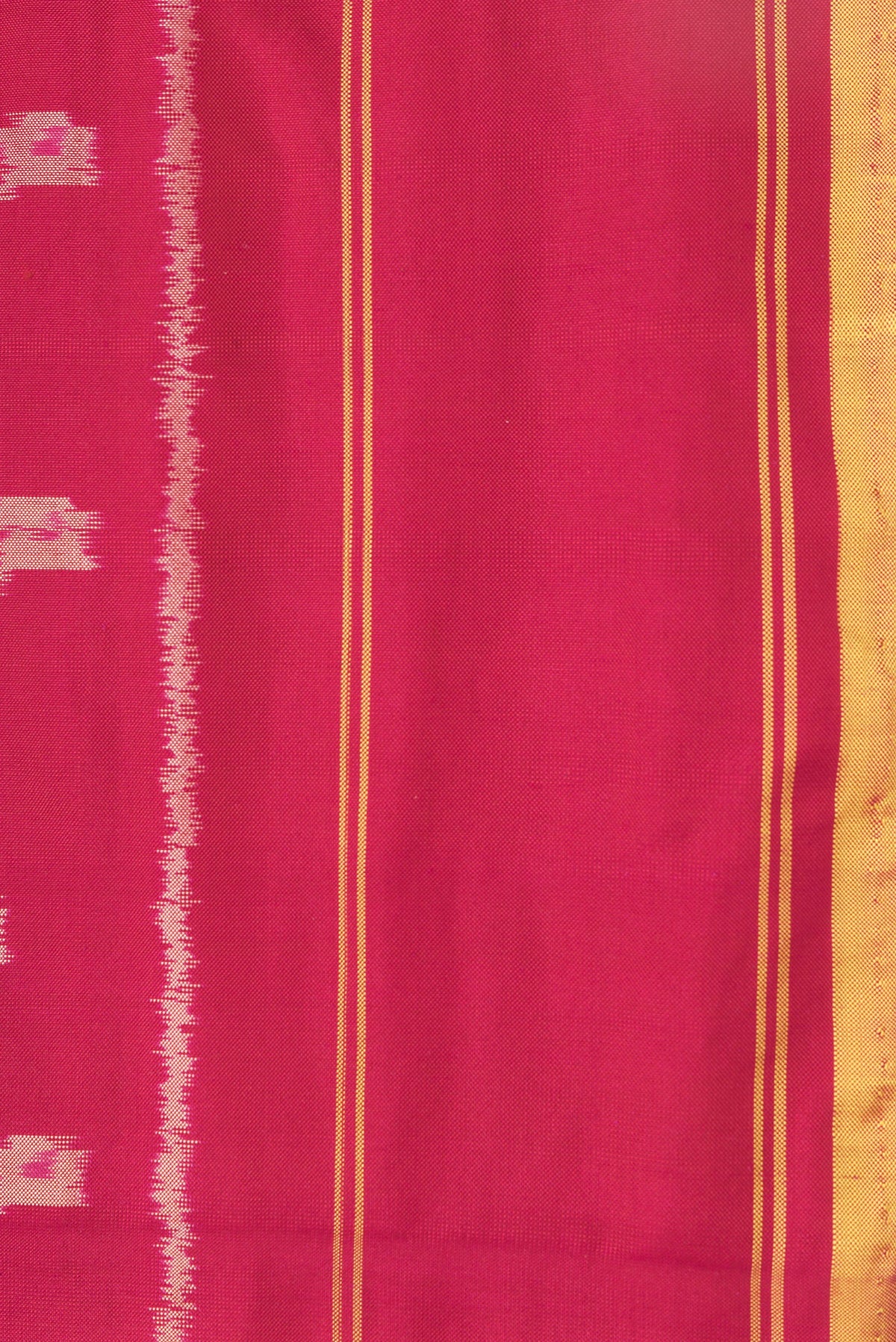 Border image of Maroon Dual Tone Double Ikat Saree with Ikat Print on the body and Plain Border. 