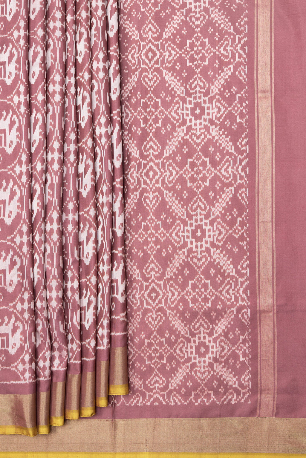 Pleats and pallu of Brown Dual Tone Double Ikat Saree with Ikat Print on the body and Zari Border. 