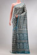Grey Dual Tone Tussar Silk Saree with Checked design on the body and Fancy Border.  displayed on a mannequin