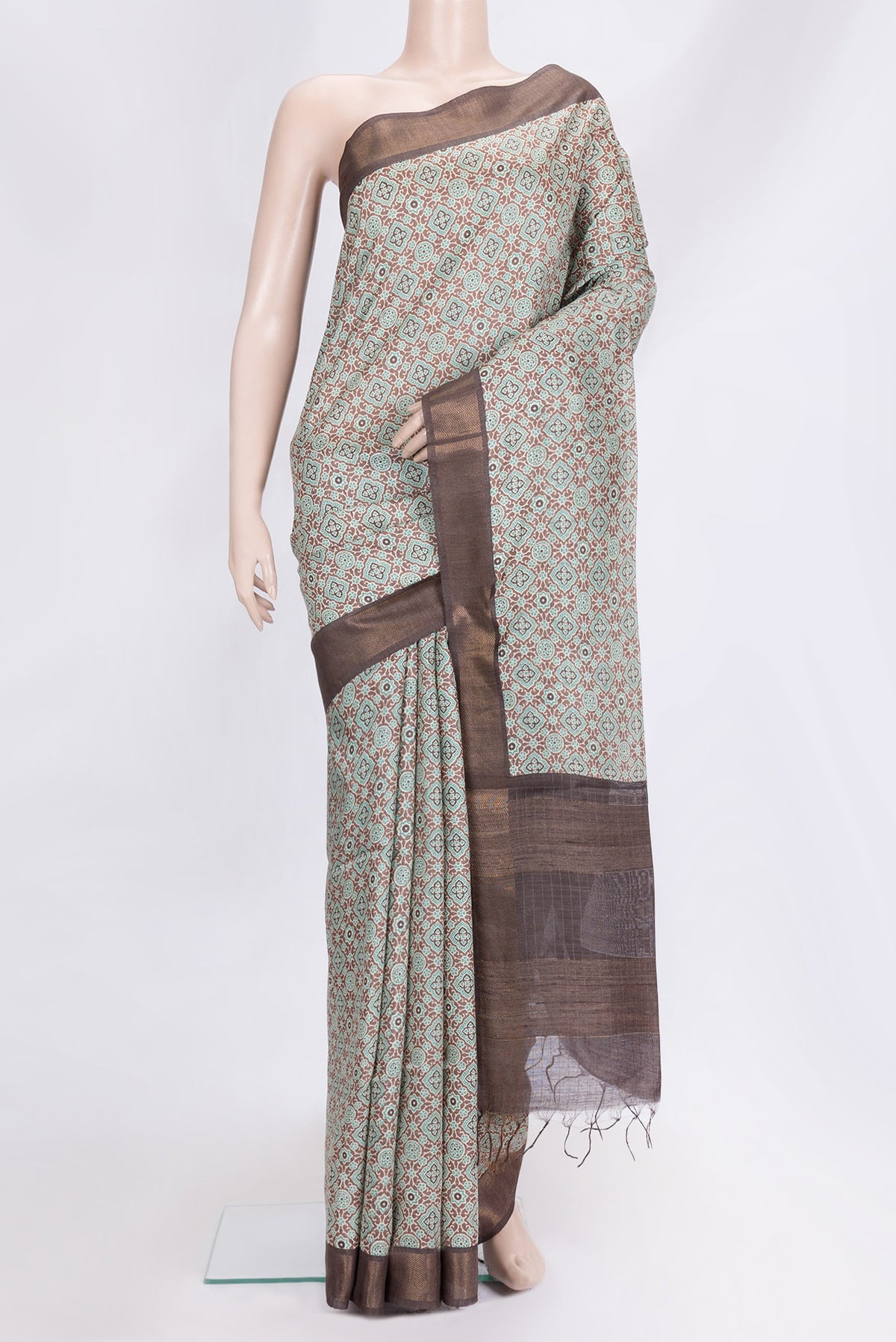 Brown Dual Tone Tussar Silk Saree with Printed design on the body and Zari Border.  displayed on a mannequin