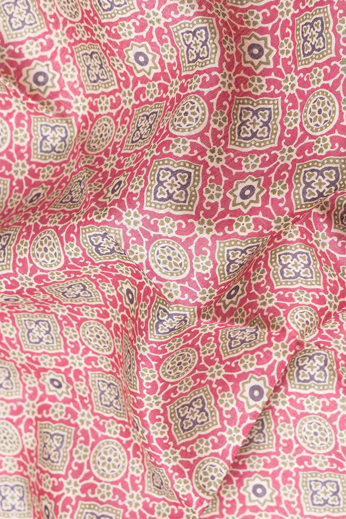 Close up of Magenta Dual Tone Tussar Silk Saree with Printed design on the body and Zari Border.  displaying folds
