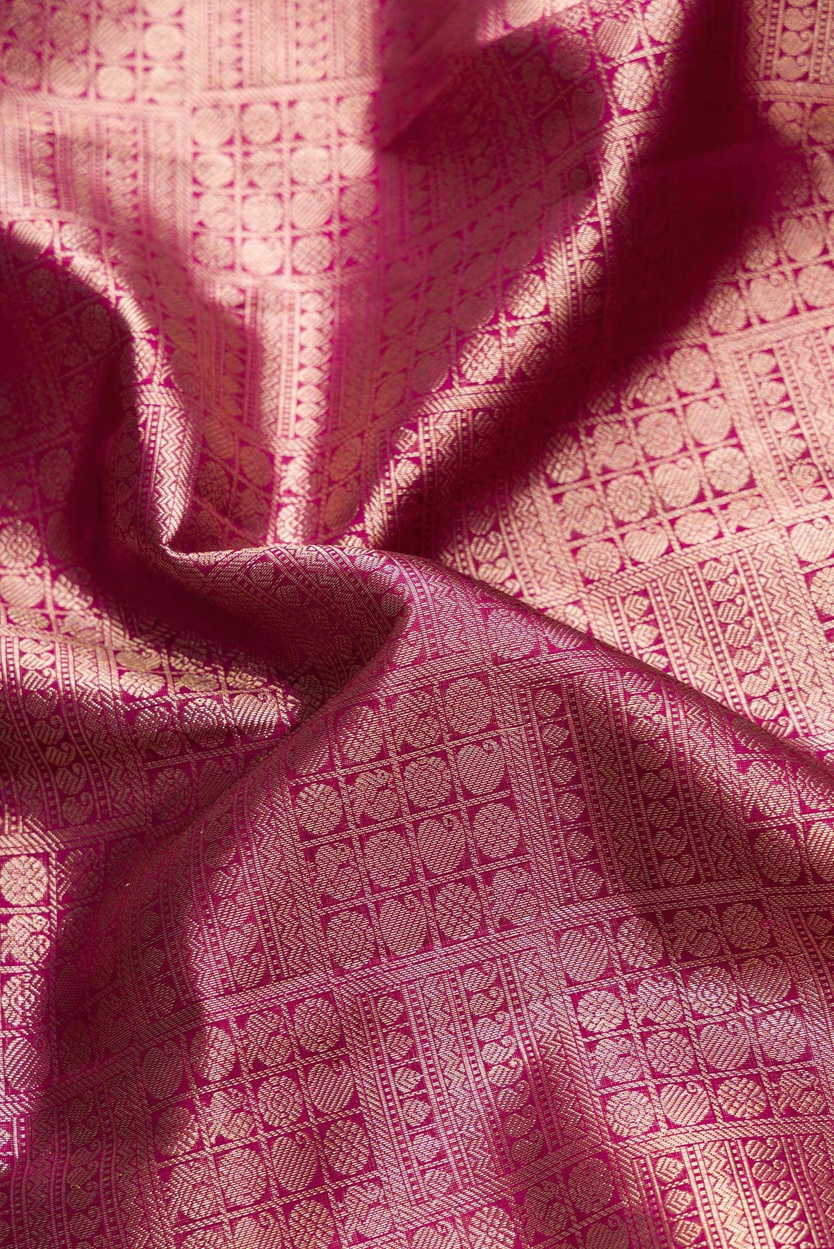 Close up of Purple Dual Tone Kanchipuram Silk Saree with Zari Brocade on the body and Zari Border.  displaying folds