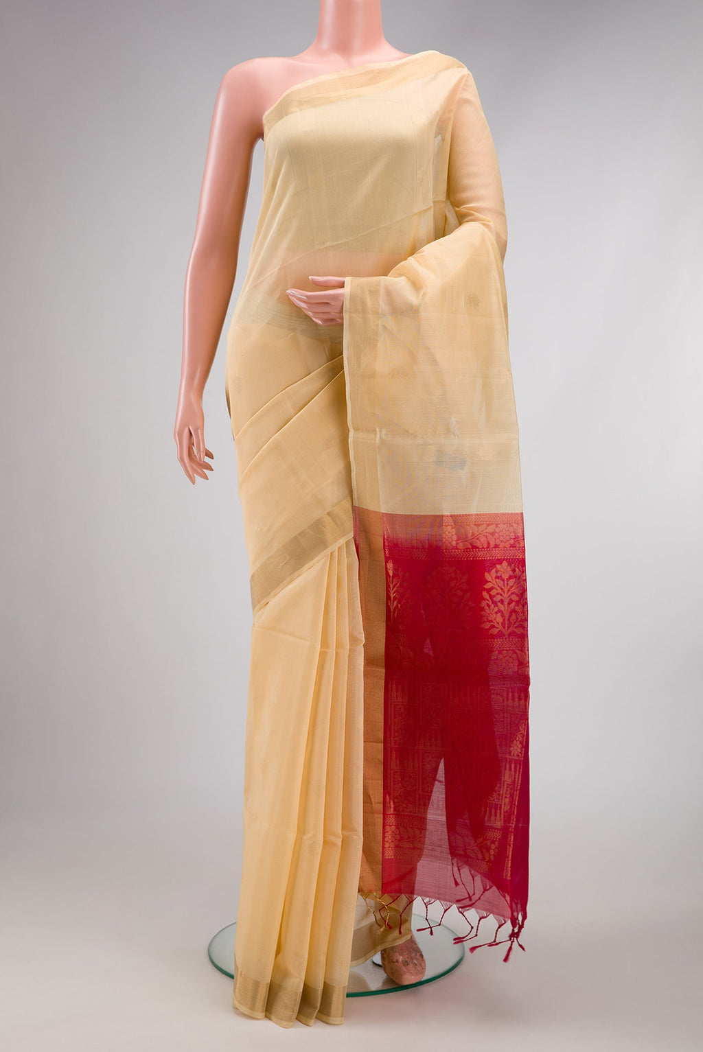 Sandal Silk Cotton Saree with Zari Butta on the body and Zari Border.  displayed on a mannequin
