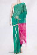Green Silk Cotton Saree with Zari Butta on the body and Zari Border.  displayed on a mannequin