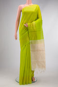 Parrot Green Silk Cotton Saree with Zari Butta on the body and Fancy Border.  displayed on a mannequin