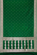 Bottle Green Dual Tone Banarasi Silk Saree with Zari Butta on the body and Zari Border.  displayed on a mannequin