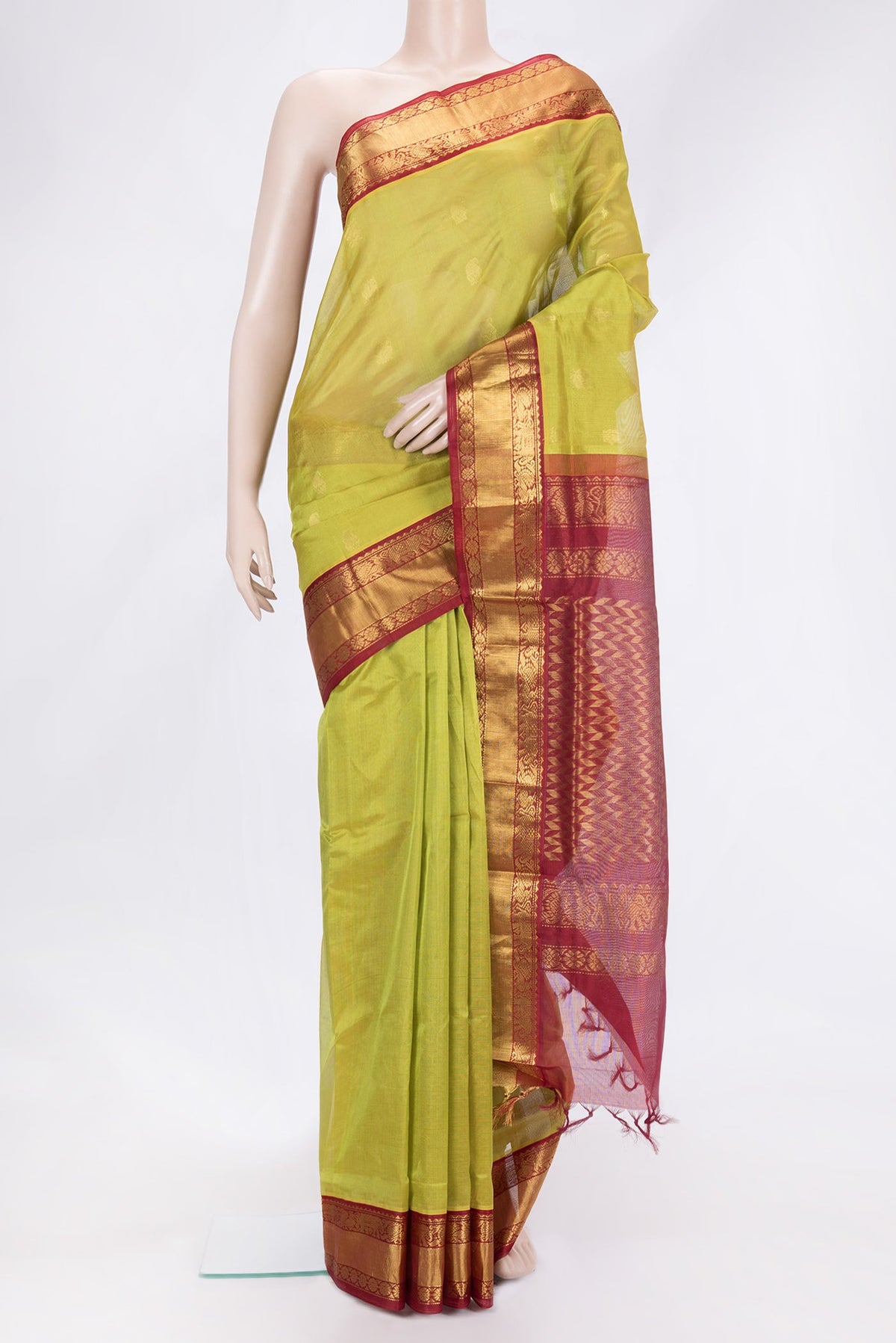 Green Dual Tone Silk Cotton Saree with Zari Butta on the body and Zari Border.  displayed on a mannequin