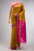 Mustard Silk Cotton Saree with Stripes on the body and Zari Border.  displayed on a mannequin