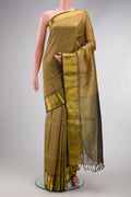 Beige Silk Cotton Saree with Checked design on the body and Zari Border.  displayed on a mannequin