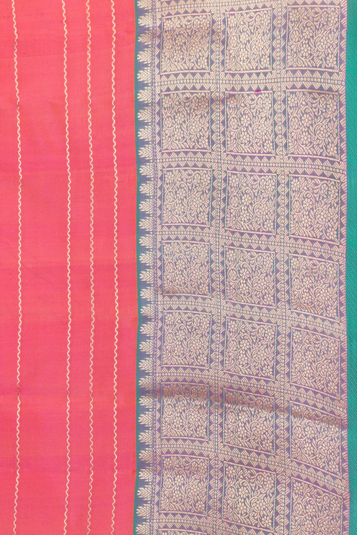 Border image of Orange Dual Tone Kanchipuram Silk Saree with Stripes on the body and Zari Border. 