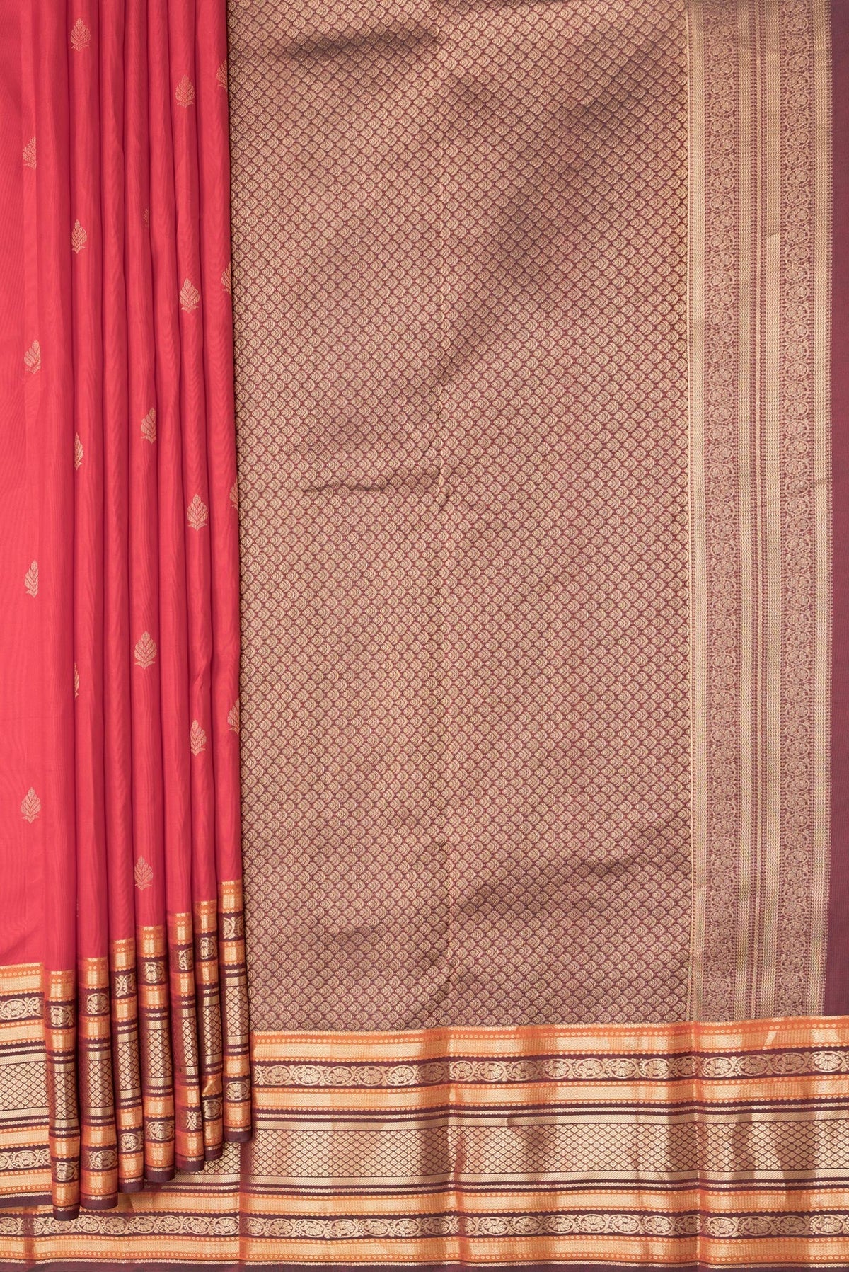 Pleats and pallu of Red Dual Tone Kanchipuram Silk Saree with Zari Butta on the body and Zari Border. 