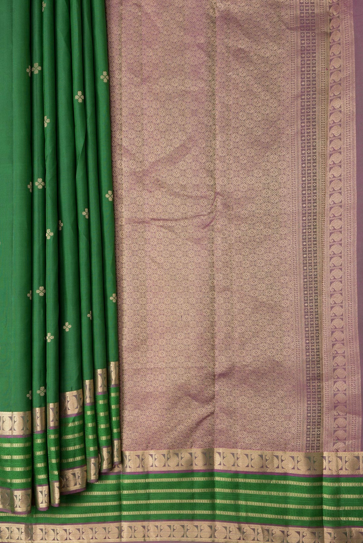 Pleats and pallu of Bottle Green Dual Tone Kanchipuram Silk Saree with Zari Butta on the body and Zari And Thread Border. 