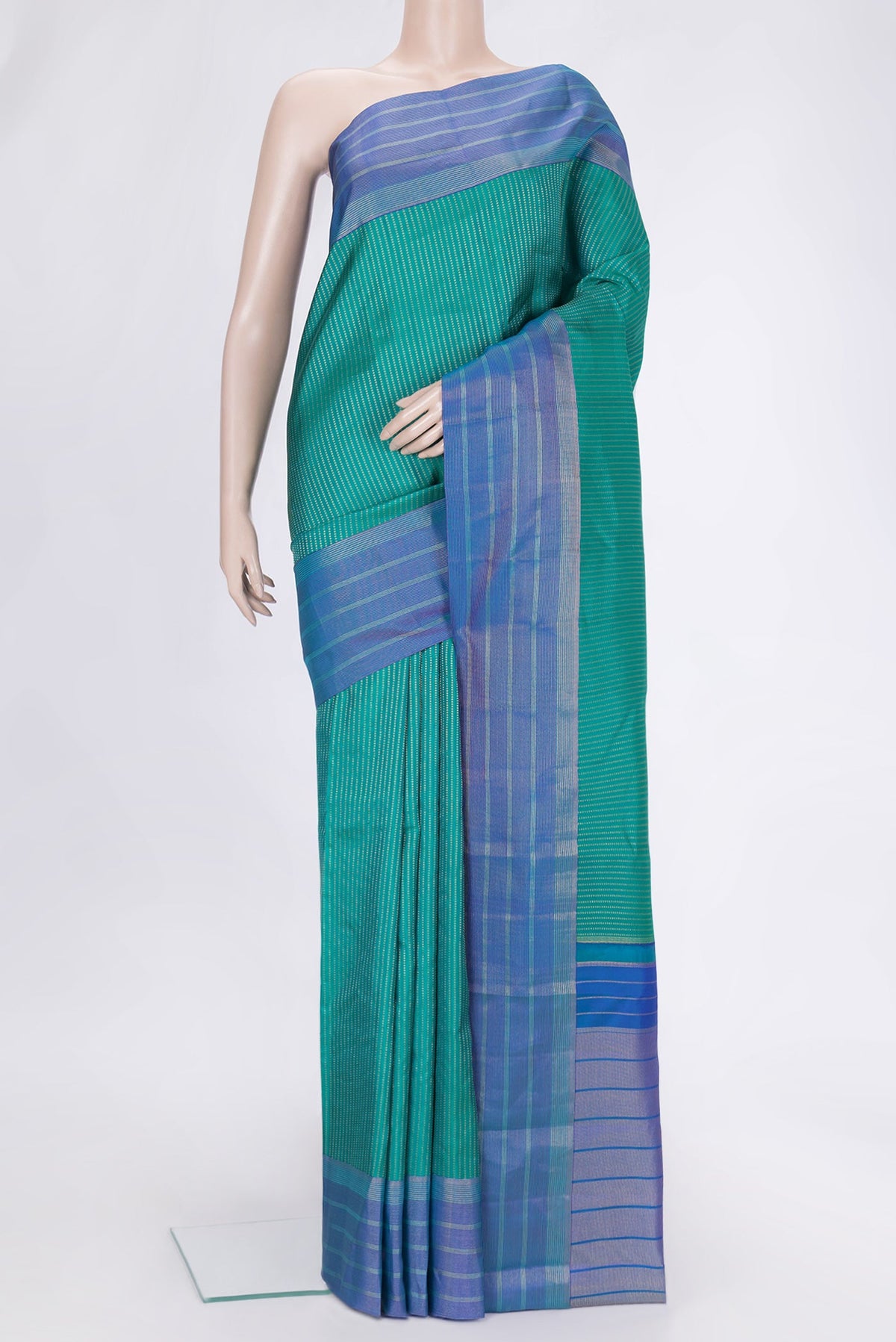 Green Dual Tone Kanchipuram Silk Saree with Stripes on the body and Zari Border.  displayed on a mannequin
