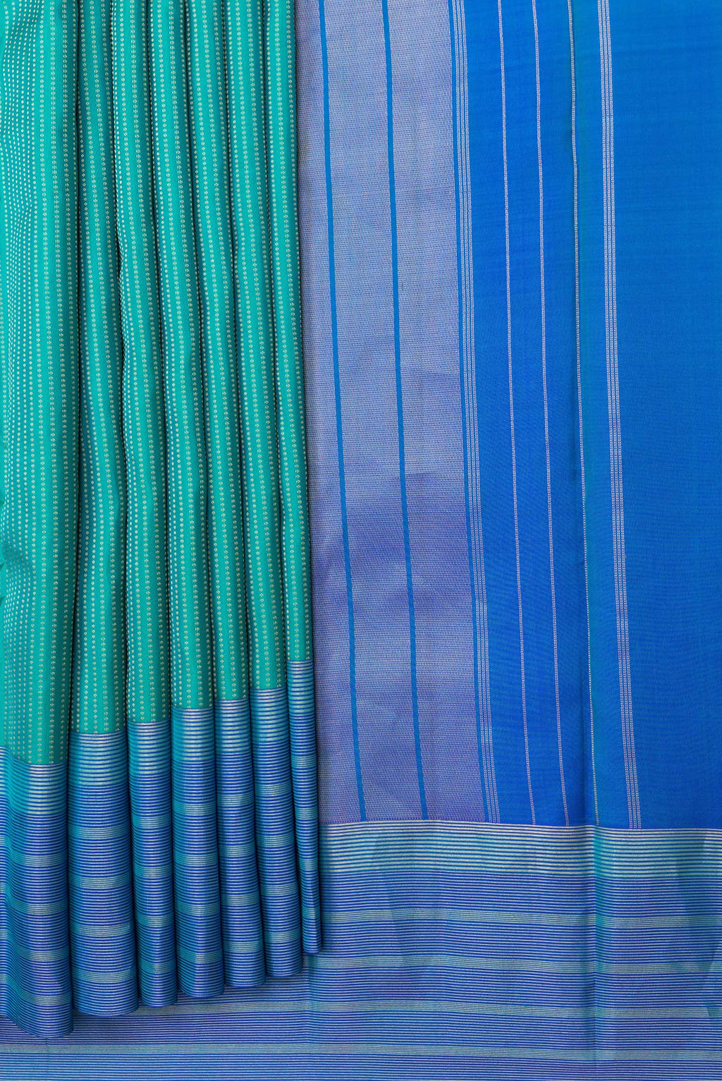Pleats and pallu of Green Dual Tone Kanchipuram Silk Saree with Stripes on the body and Zari Border. 