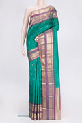 Green Dual Tone Kanjivaram Silk Saree with Zari Butta on the body and Zari Border.  displayed on a mannequin