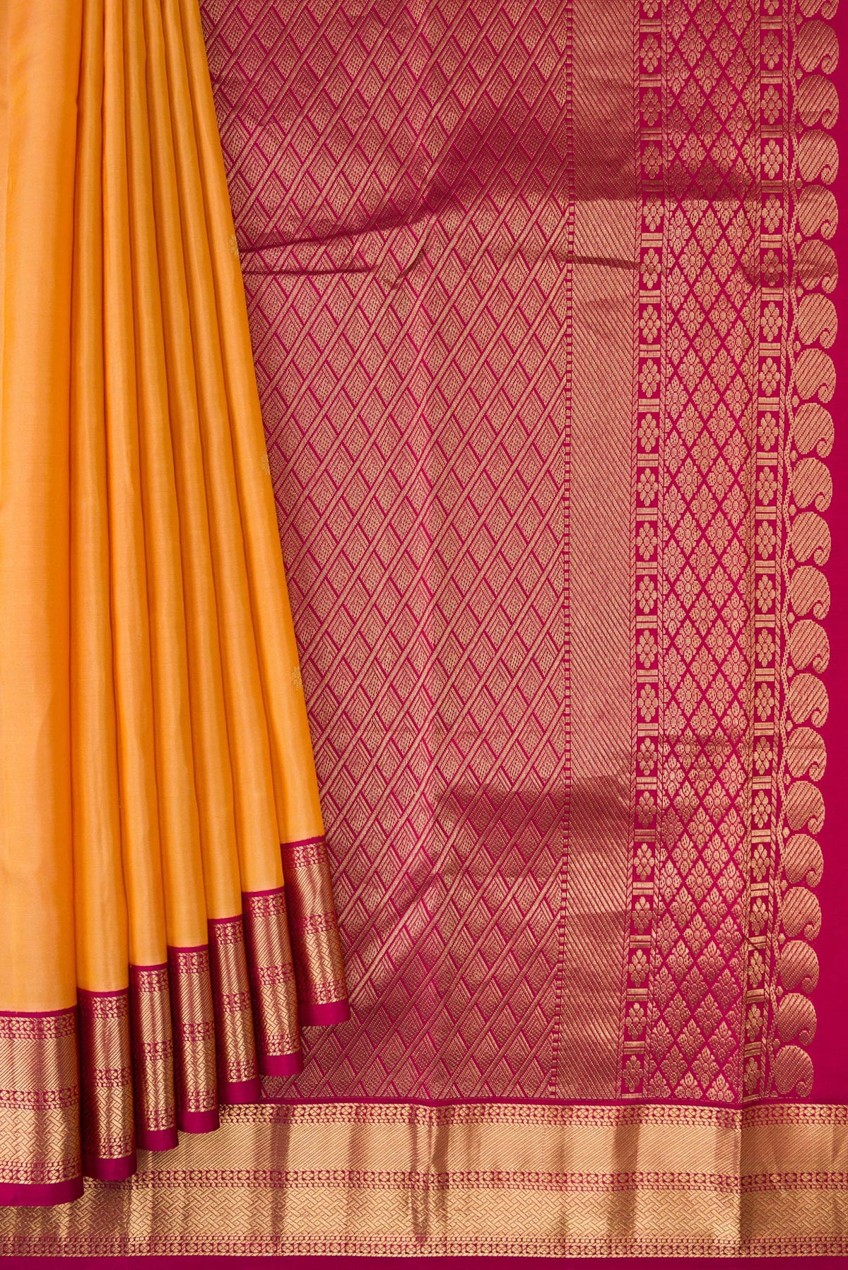 Pleats and pallu of Sandal Dual Tone Kanchipuram Silk Saree with Zari Butta on the body and Zari Border. 