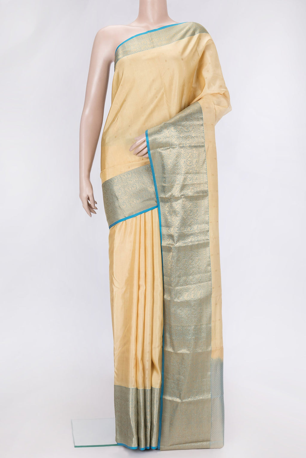 Sandal Dual Tone Kanchipuram Silk Saree with Zari Butta on the body and Zari Border.  displayed on a mannequin
